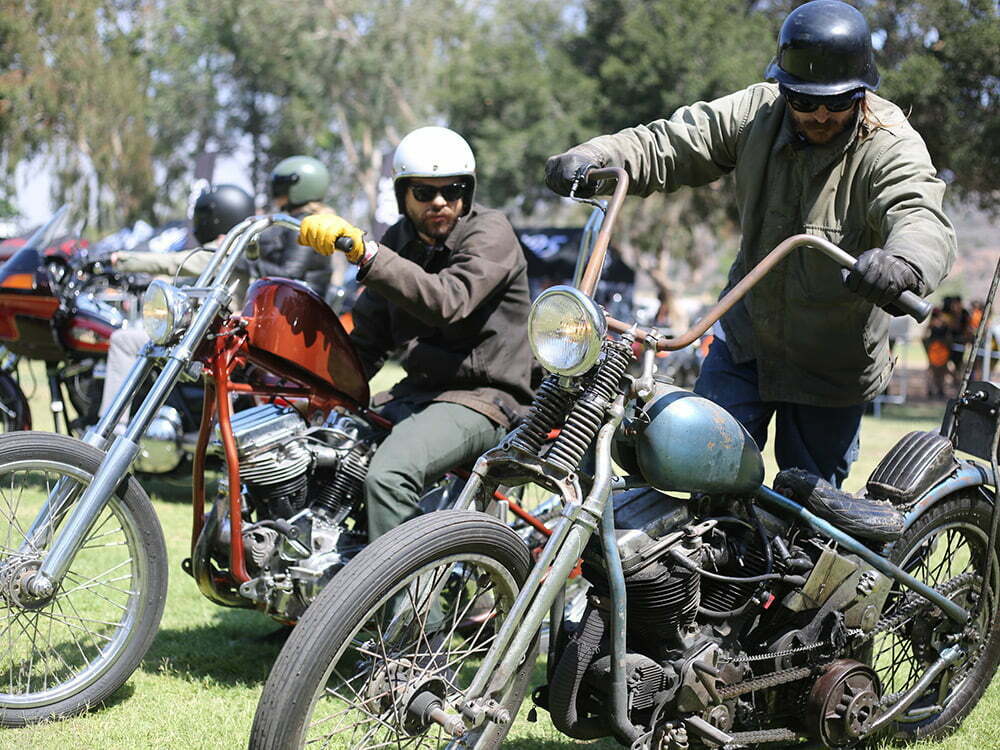 rider kickstarting panhead chopper