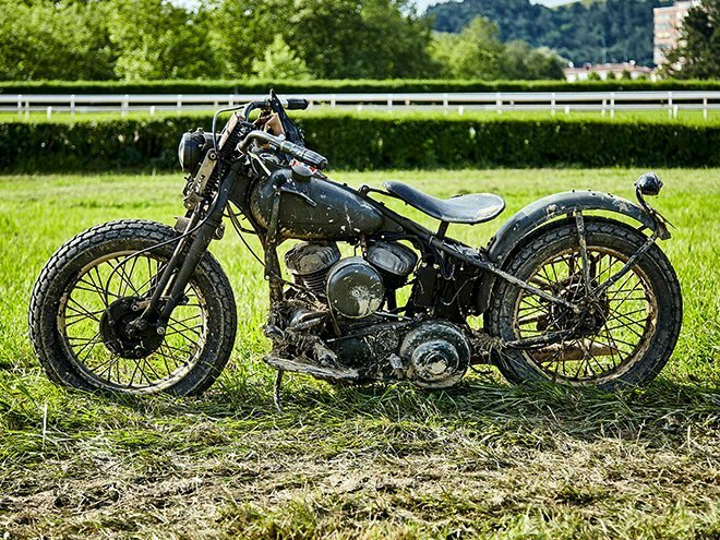 mud covered flathead with flat track rubber