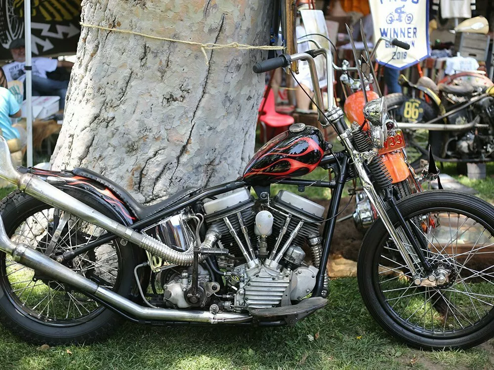 black and red chopper in the shade