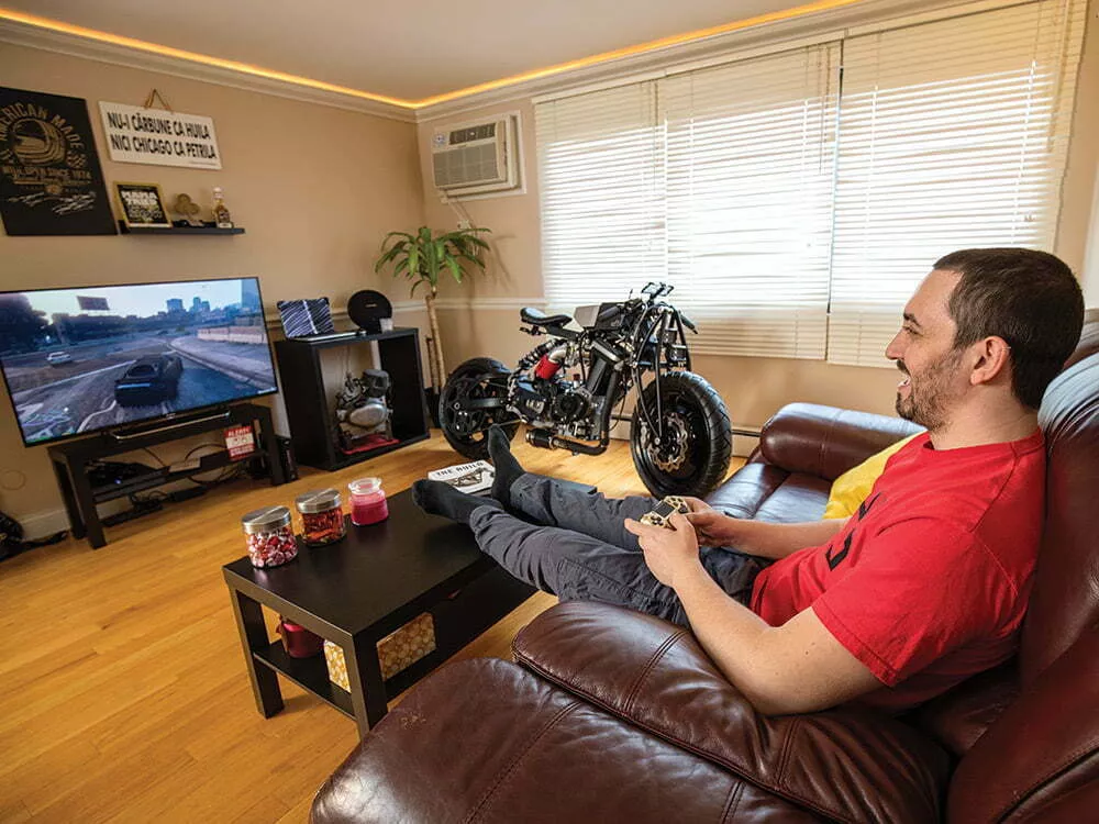 Mike Maslin in living room with Buell Blast