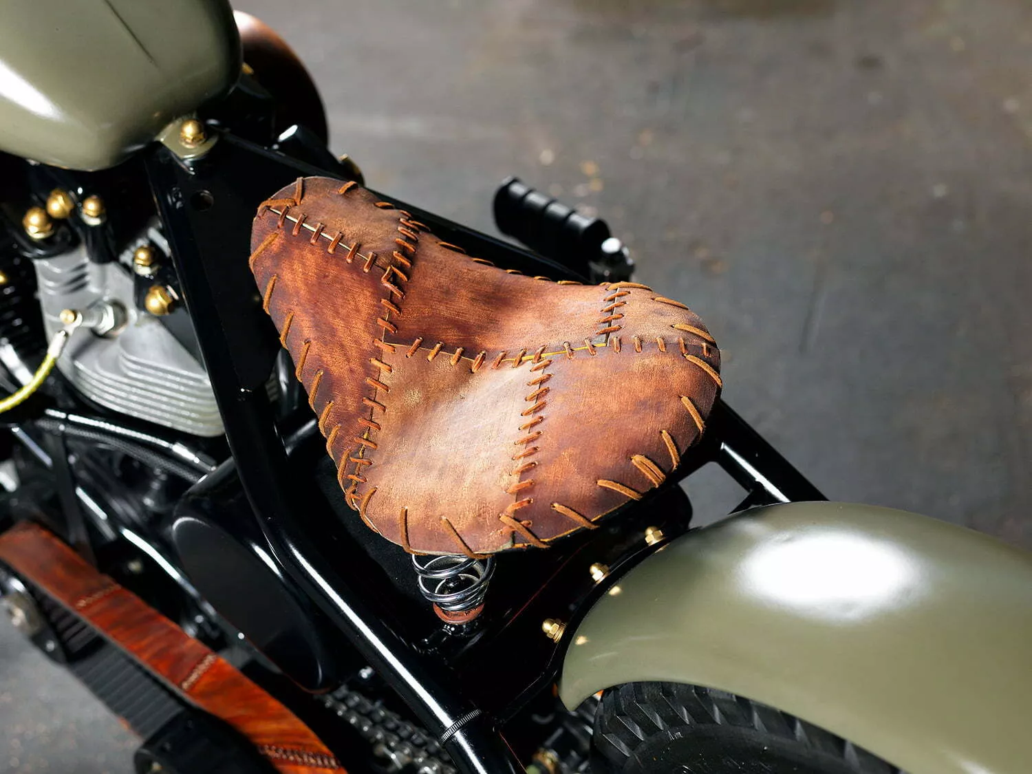 hand-tooled leather over the seat