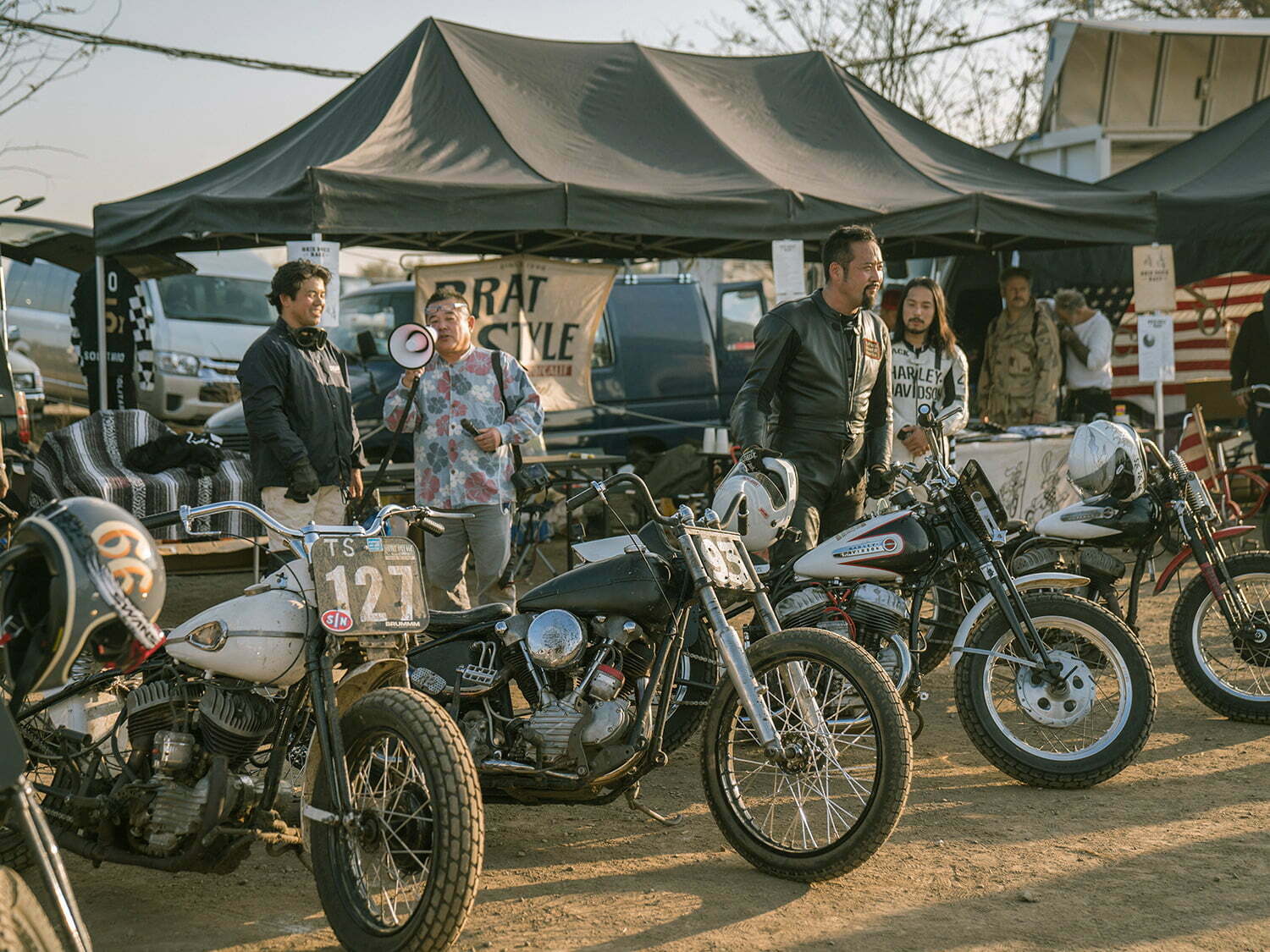 motorcycles lined up in front of Bratstyle booth