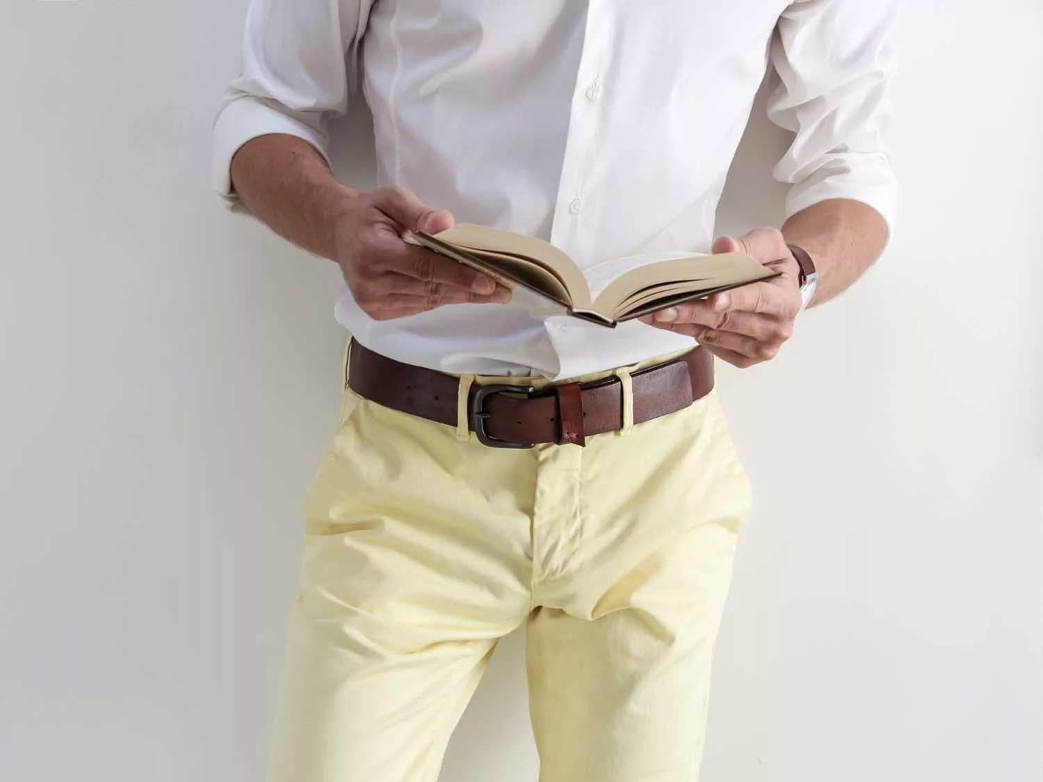 Man in yellow pants with a brown belt.