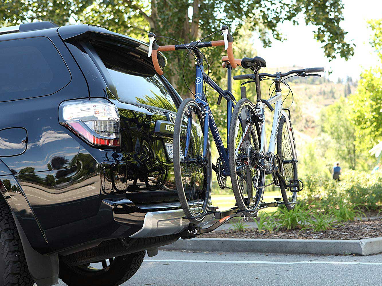 Bikes transported with hitch-mounted rack.