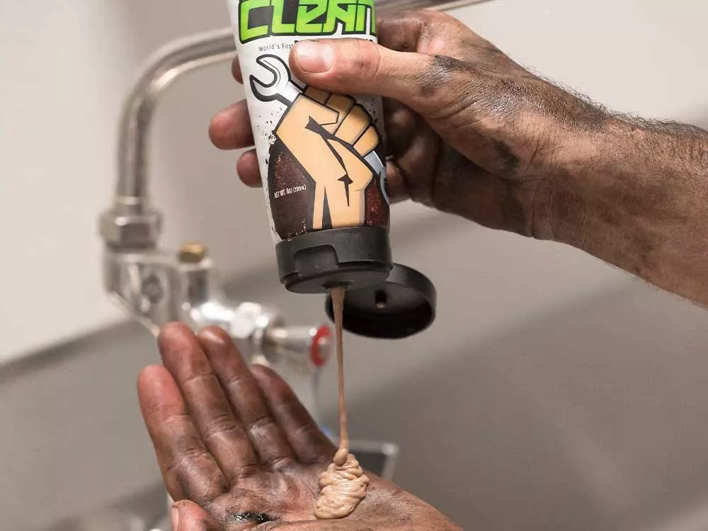 Cleaning grime off of hands with hand cleaner