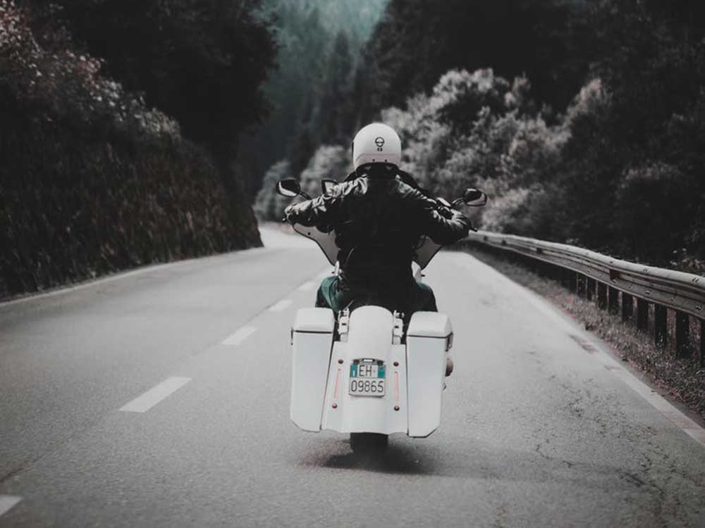 Riding motorcycle down road