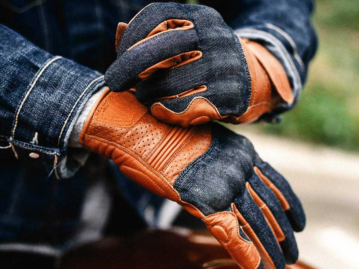 Motorcycle rider wearing gloves.