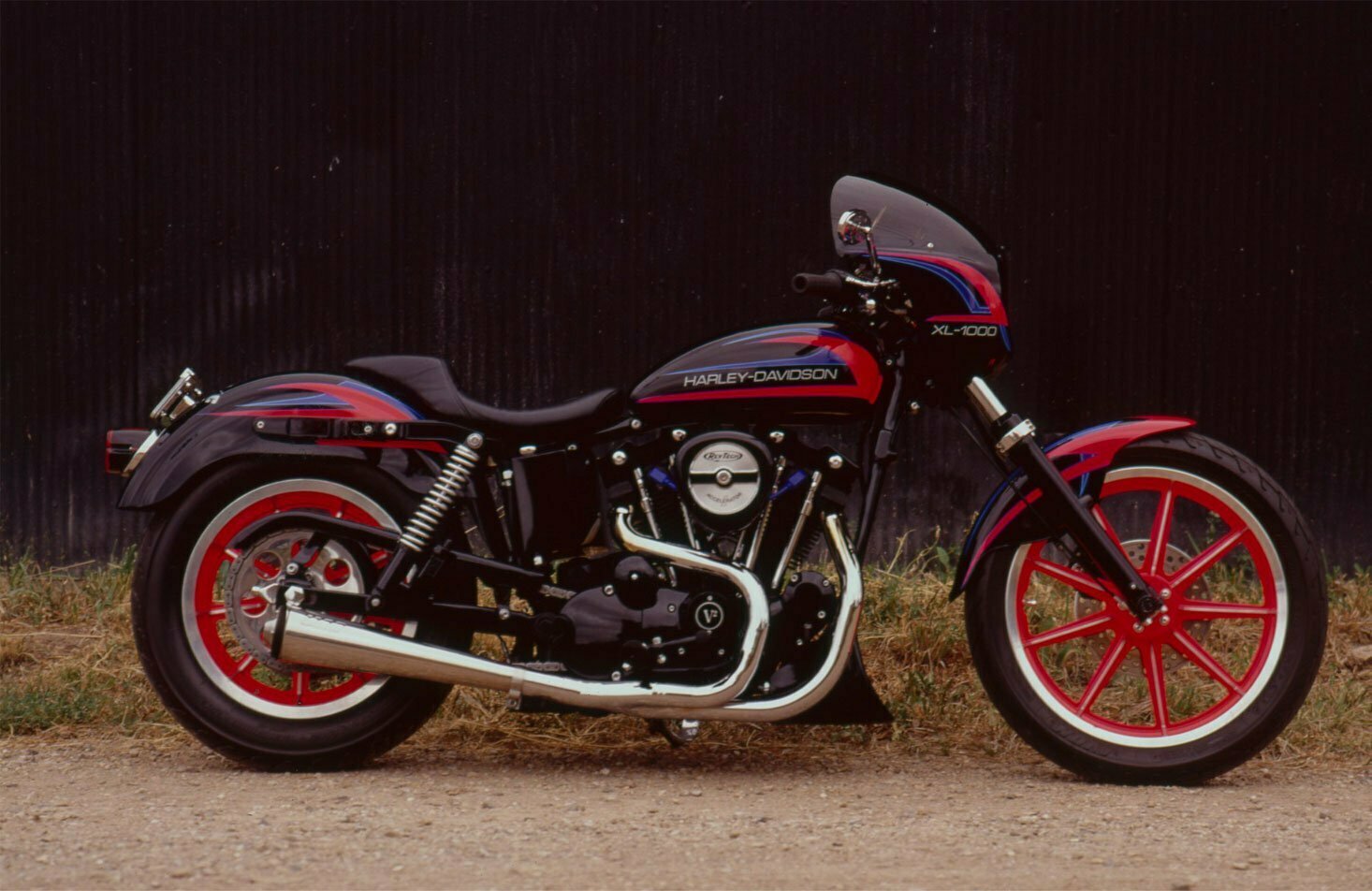 The neon-rose-finished 19- and 16-inch rims on this Sportster XL 1000 really pop.