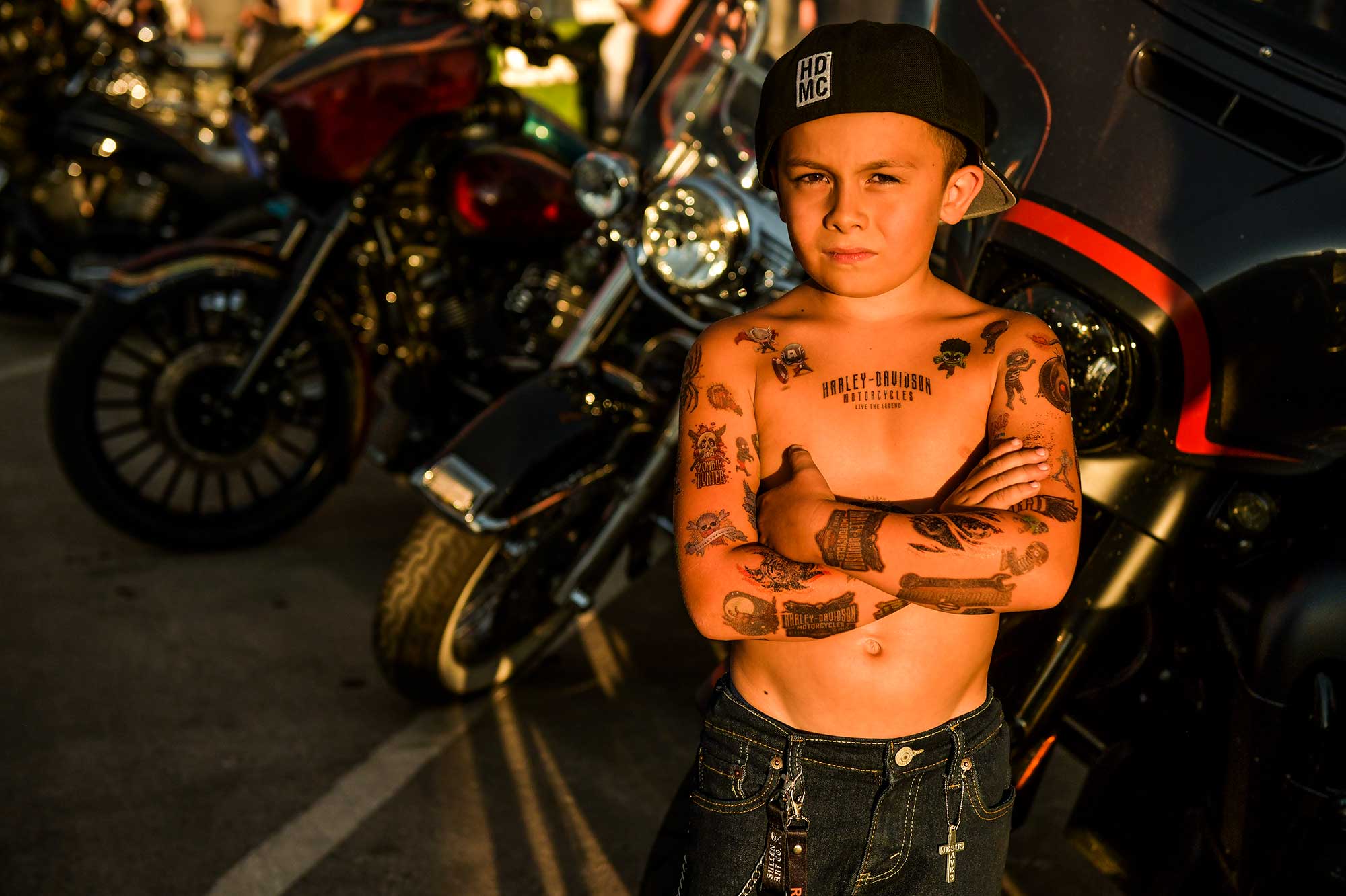 Josiah Sandoval, 7, stands for a portrait on Main Street during the annual rally.