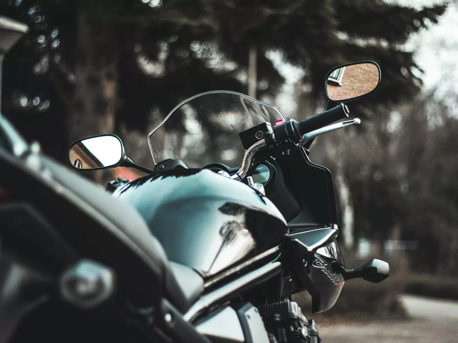 Motorcycle tank protected from scratches.