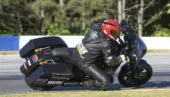 A motorcycle racer competes in the 2021 King of the Baggers race series.