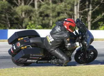 A motorcycle racer competes in the 2021 King of the Baggers race series.