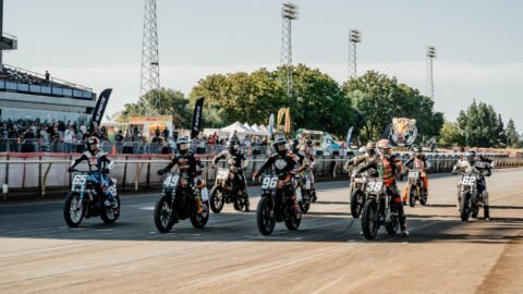 Motorcycle racers at the starting line of an American Flat Track event. 
