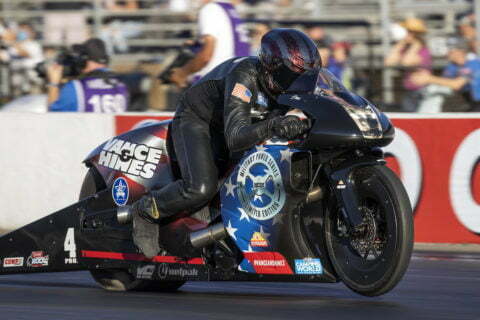 A motorcycle racer competes in an NHRA drag racing event. 