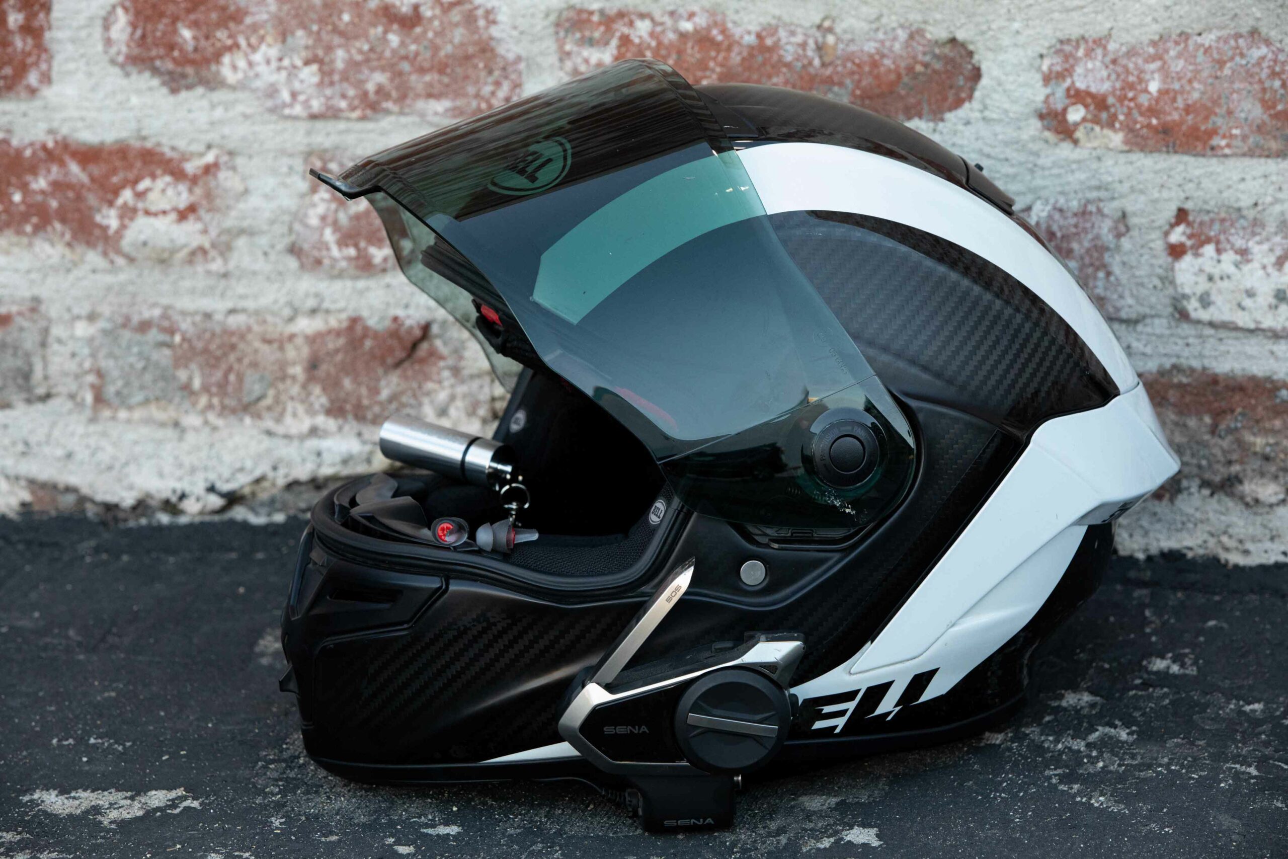 Bell motorcycle helmet with sena bluetooth and earpeace earplugs